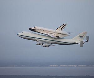 Space shuttle inches in late to LA retirement home