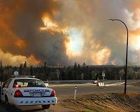 Canada's fire-ravaged Fort McMurray works to restore utilities