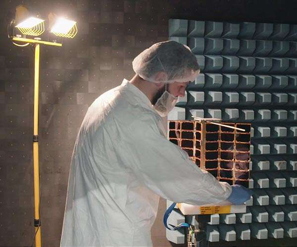 Machine-learning nanosatellites to monitor global trade