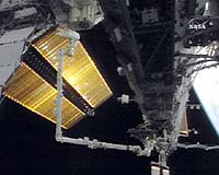 Two Atlantis Space Walkers Work On ISS Solar Arrays