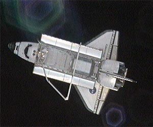 Earth-bound space shuttle in third landing attempt