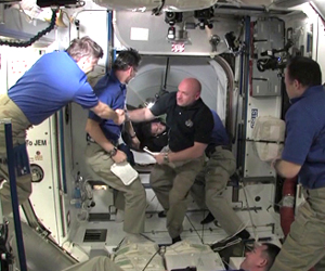 STS-134 Arrives, Crew Begins Work at Station