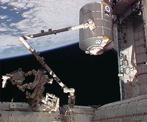 Crew Wraps Up Busy Day of Cargo Transfers, Spacewalk Preps