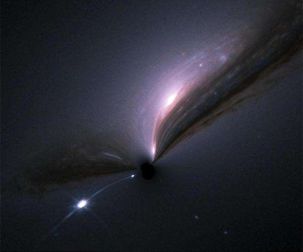 Light-bending gravity reveals one of the biggest black holes ever found