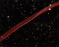Hubble Sees Stars And A Stripe In Celestial Fireworks