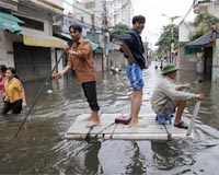 More rain as Vietnam flood toll rises to 74