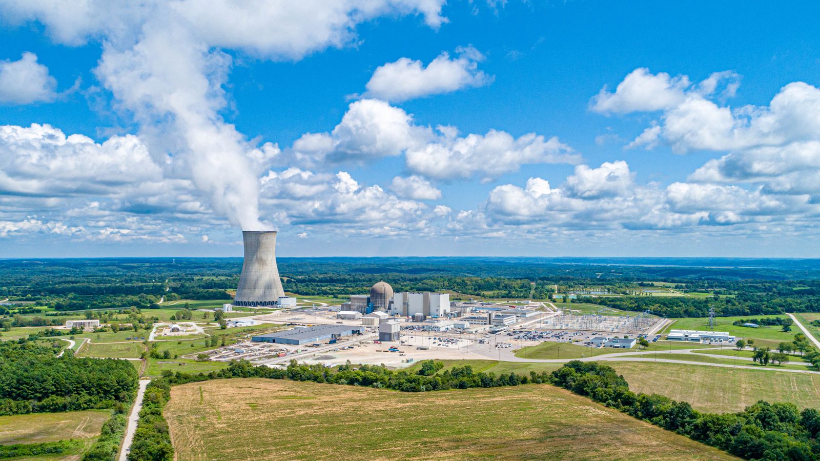 A CANDU reactor runs on unenriched natural uranium because it uses heavy water as its moderator, a form of water in which each hydrogen carries an extra neutron, making the molecule about 10 percent denser and letting Canada skip the entire enrichment industry the rest of the nuclear world was built around